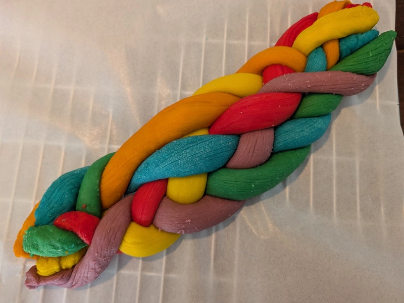 A rainbow six-strand chaotic challah