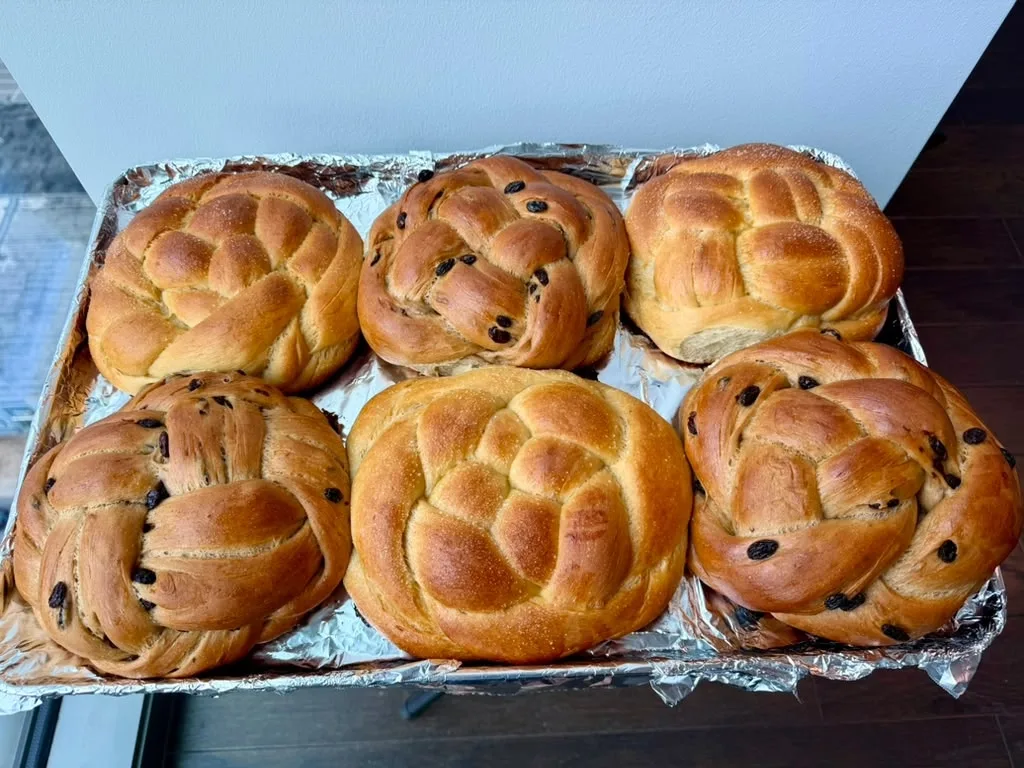 Round cinnamon raisin challah, baked golden