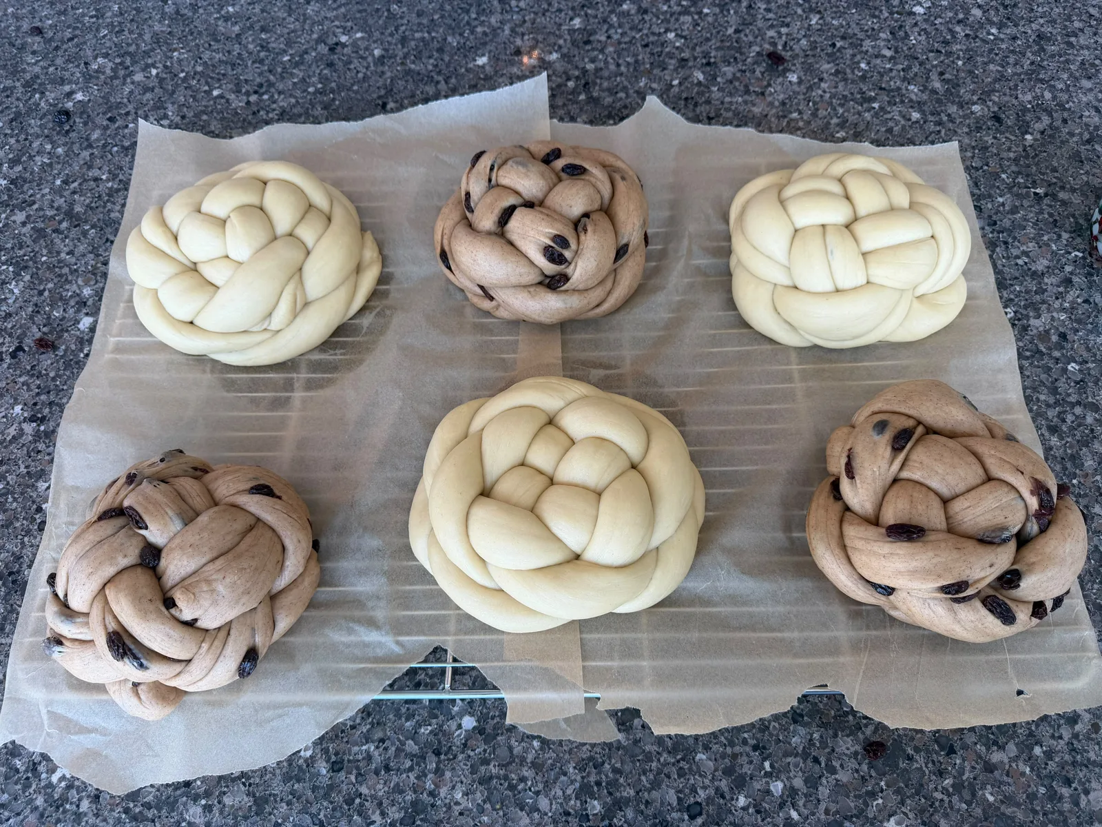 Round braided challah dough before baking